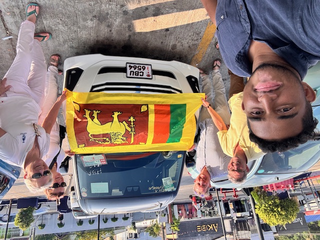 Travellers with the Sri Lankan flag arriving at their hotel