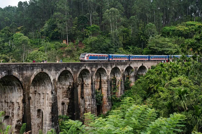 The blue train crossing the Nine Arch Bridge